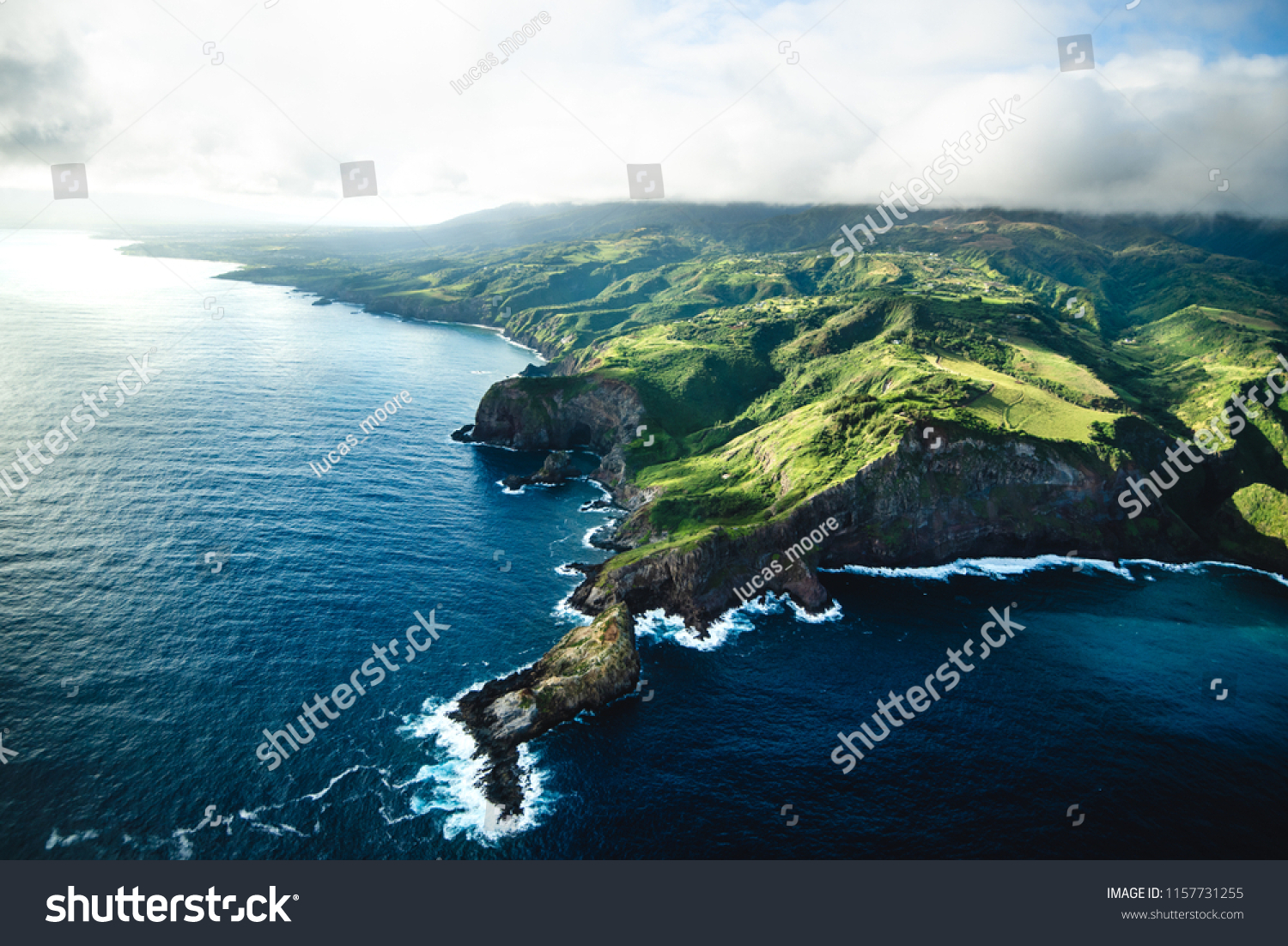 Beautiful Aerial View of Tropical Island Paradise Nature Scene of Maui Hawaii On Clear Sunny Day with Vibrant Blue Ocean Water and Waves and Lush Green Mountain Scenic Landscape  #1157731255