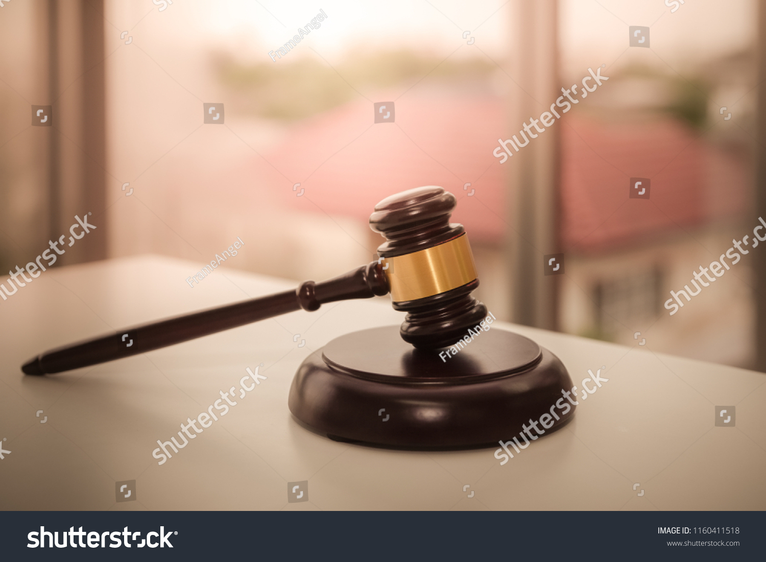 Auction wooden hammer bid sale on the table for law and justice with house background concept #1160411518