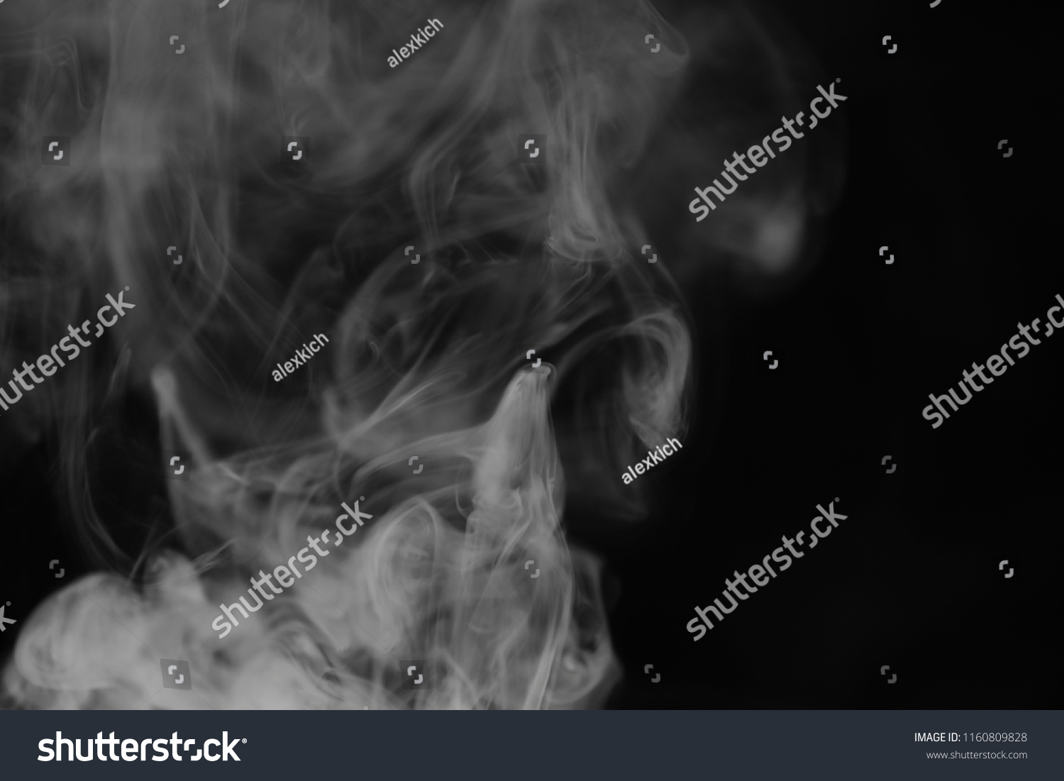 White smoke on a black background. Texture of smoke. Clubs of white smoke on a dark background for overlay
 #1160809828
