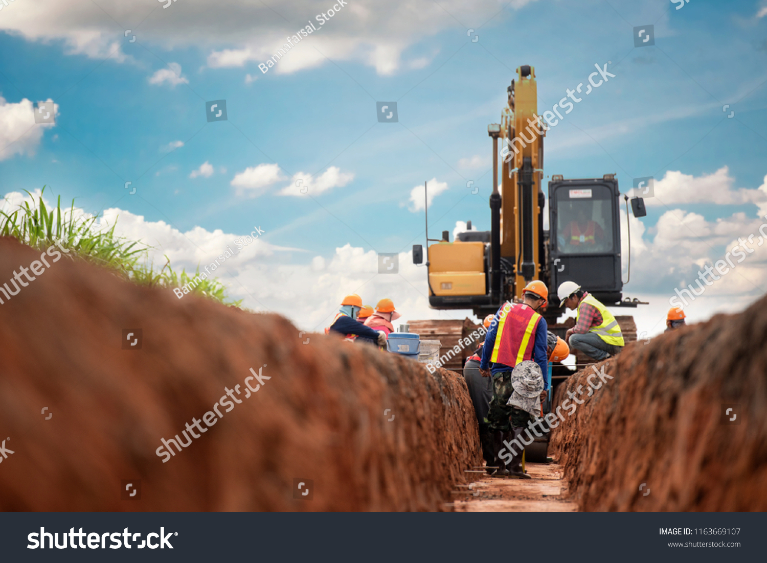 Group of worker and construction engineer wear safety uniform excavation water drainage at construction site #1163669107