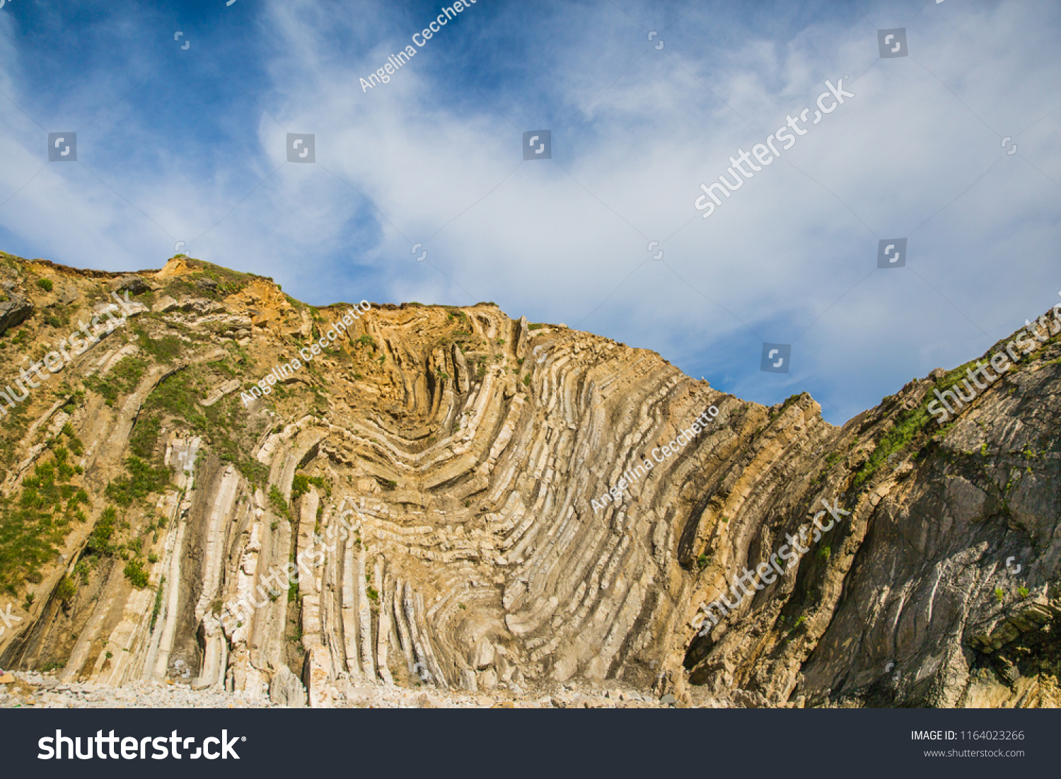 Limestone Foldings on Stair Hole Chalk Cliffs and Blue Sky #1164023266