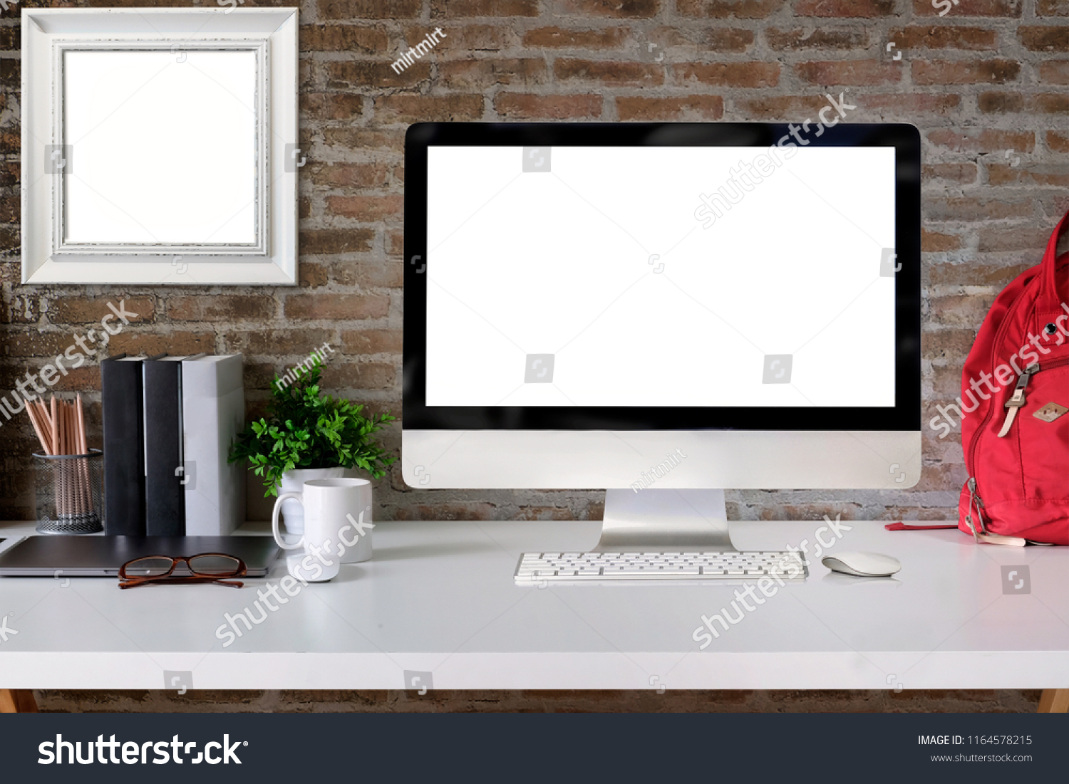 Loft student workspace with blank screen desktop computer on white wood desk. #1164578215