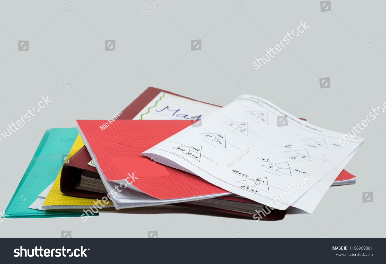stack of homework, mathematics task, books, file, booklet and white background #1166909881