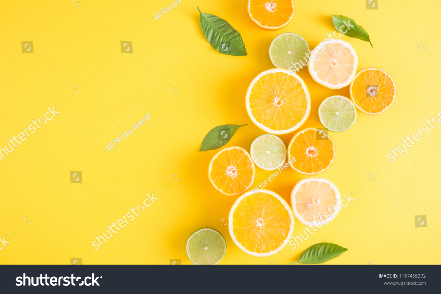 Creative background made of summer tropical fruits with leaves, grapefruit, orange, tangerine, lemon, lime on pastel yellow background. Food concept. Flat lay, top view, copy space #1167455272
