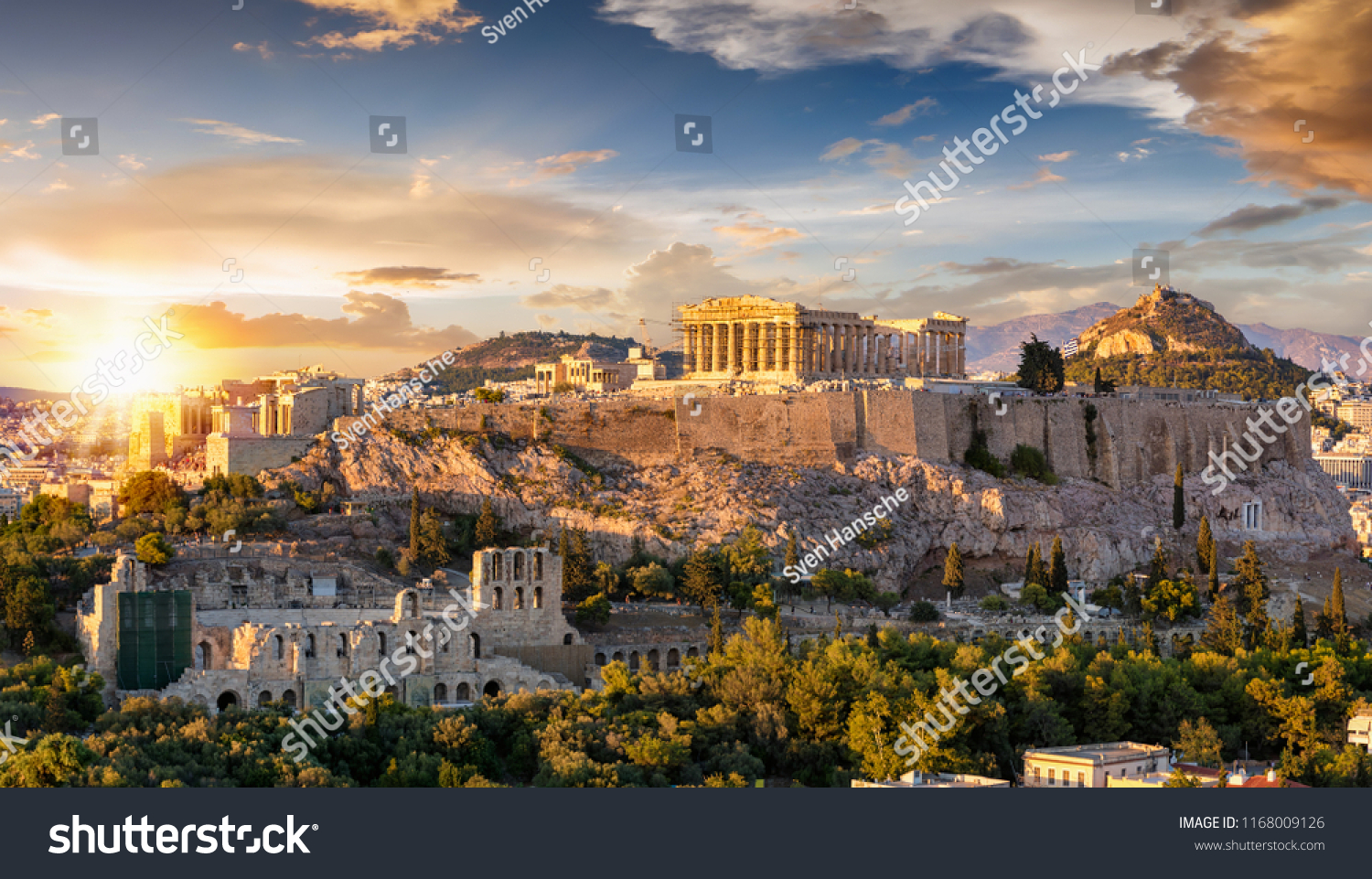 The Acropolis of Athens, Greece, with the Parthenon Temple on top of the hill during a summer sunset #1168009126