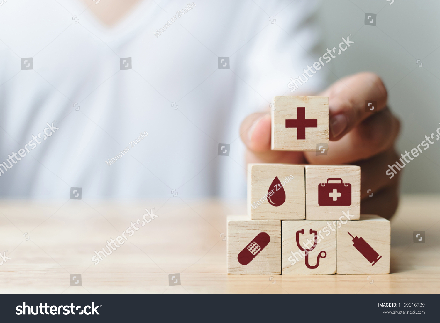 Hand arranging wood block stacking with icon healthcare medical, Insurance for your health concept #1169616739