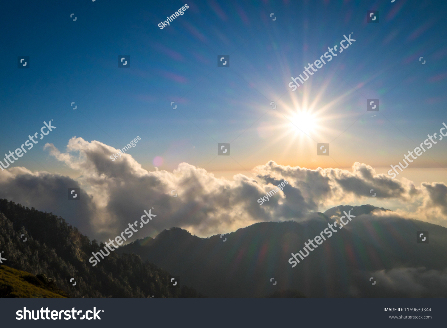 A breathtaking landscape in Taiwan. This was taken on top of a mountain. The clouds formation is vast and dramatic. The sun rises above the thick clouds. The image is calm, peaceful and magnificent. #1169639344