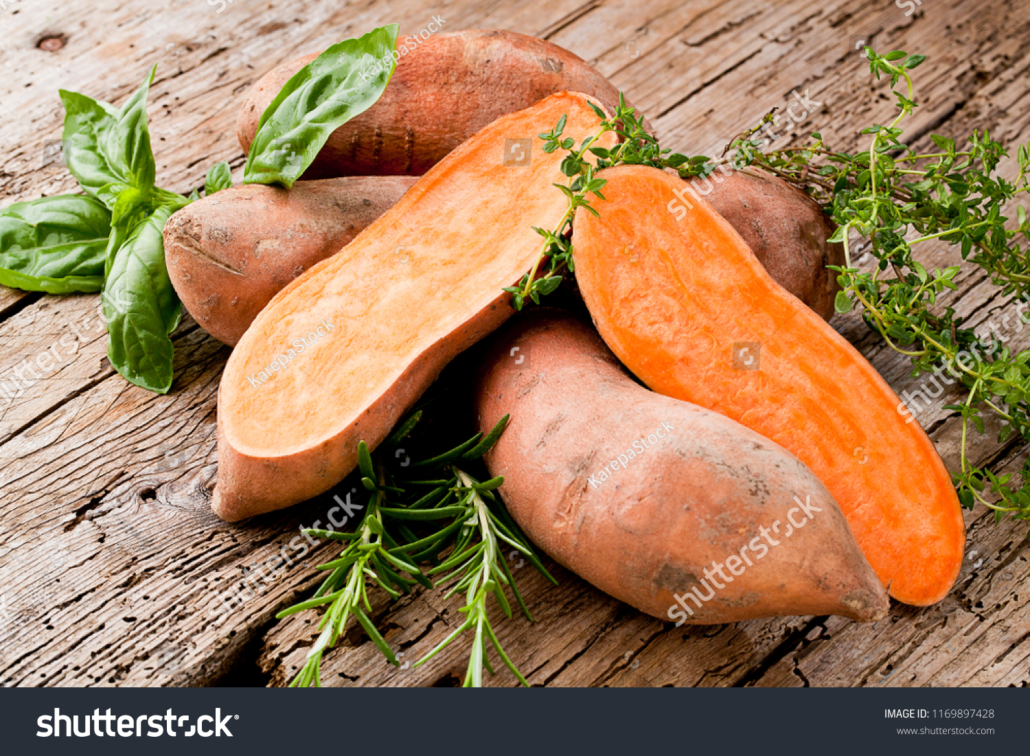 Sweet potato on Wooden background  #1169897428