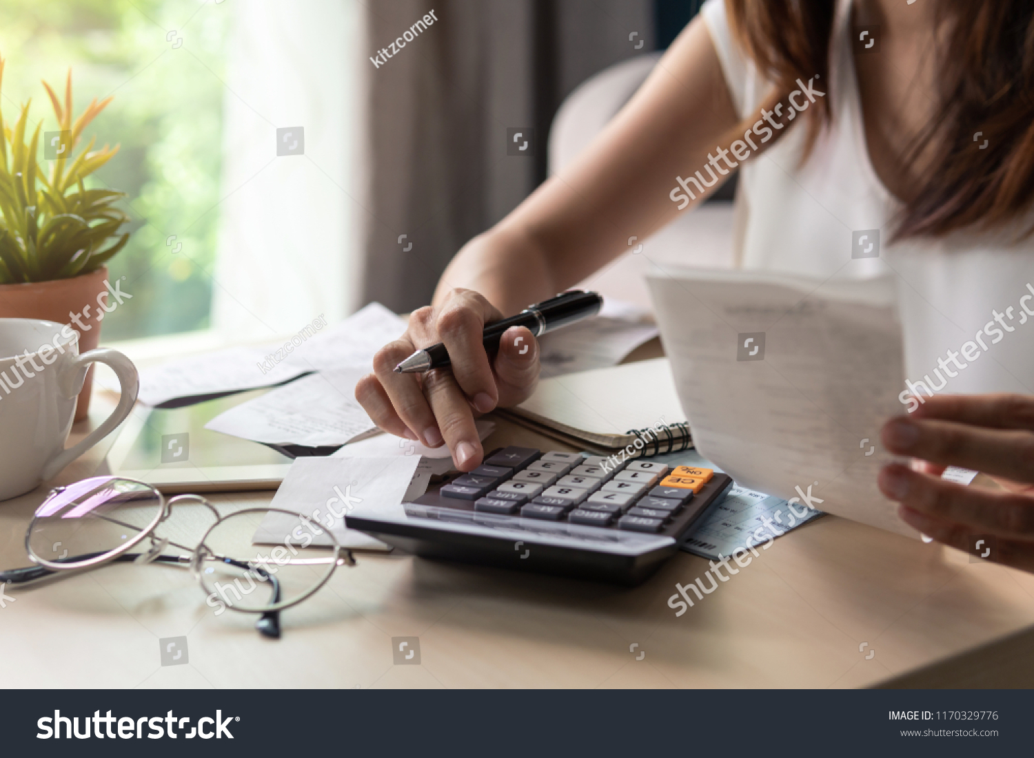Stressed young woman calculating monthly home expenses, tax, bank account balance and credit card bills payment, Income is not enough for expenses. #1170329776