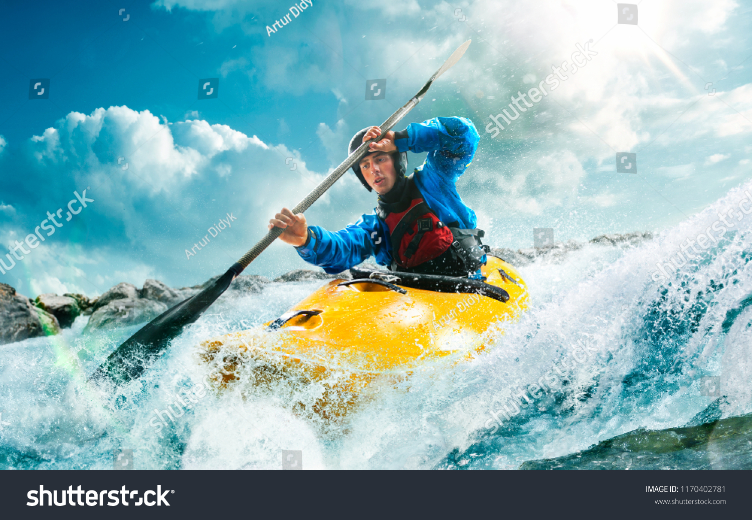 Whitewater kayaking, extreme kayaking. A guy in a kayak sails on a mountain river #1170402781