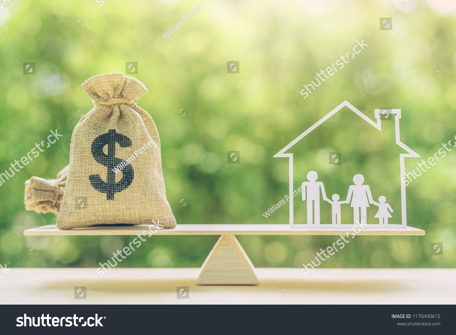 Cost of living, home loan, family finance and child trust fund concept : US dollar bags, family members live inside a house on basic balance scale, depicts the expenditure a family should prepare for #1170490615