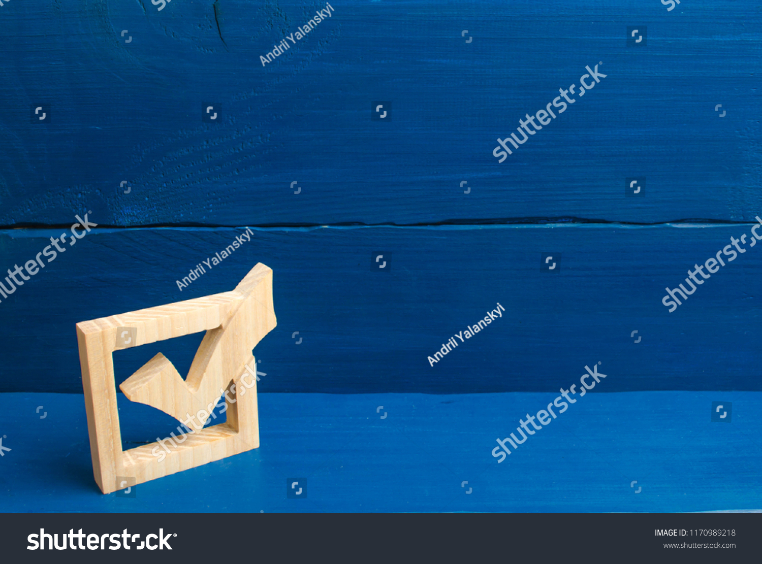 Election of the President or Government. Democracy, development, civil initiative. A wooden checkmark in the box on a blue background. The concept of suffrage, voting in elections. #1170989218