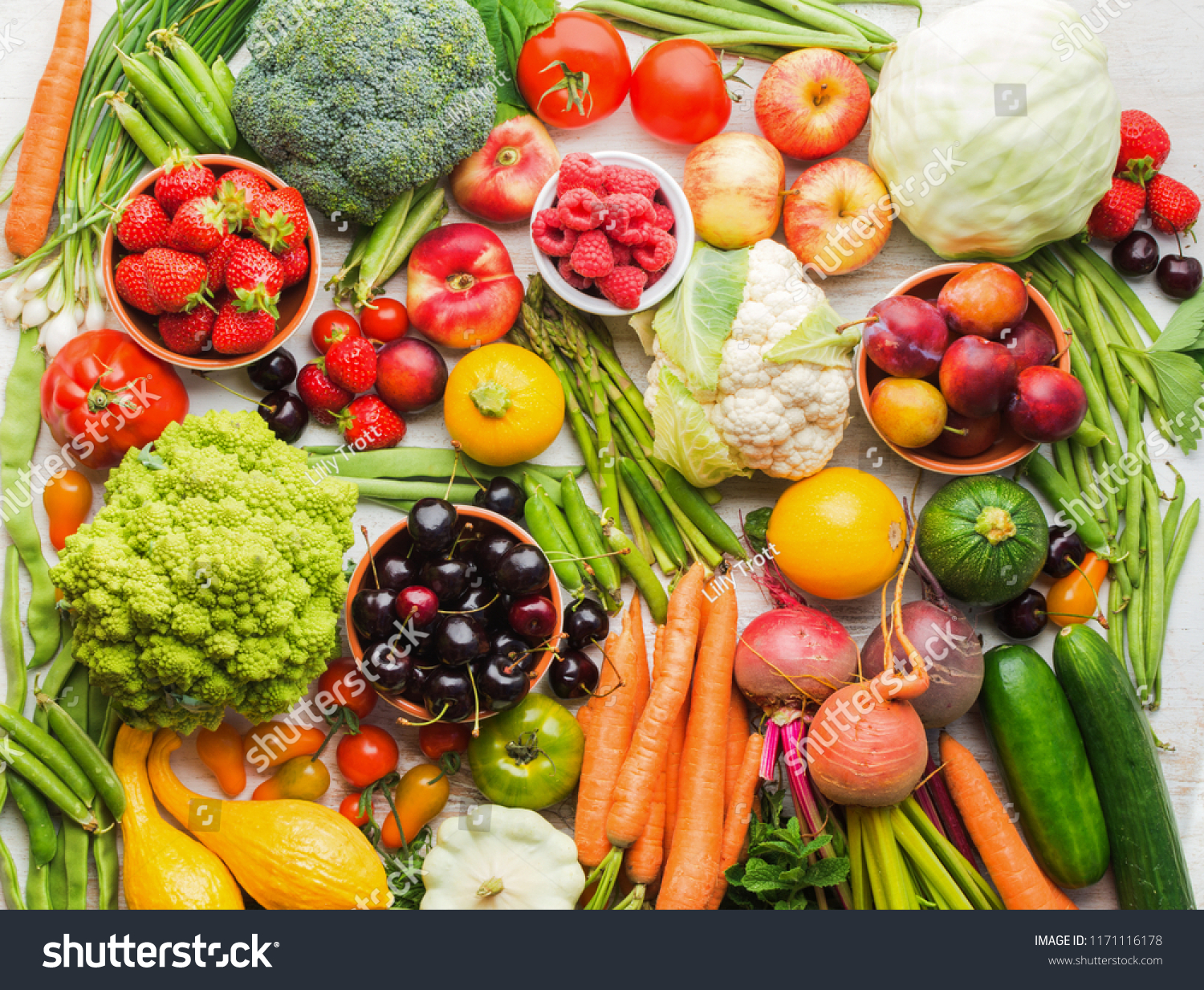 Summer fruits vegetables berries background, apples cherries peaches strawberries cabbage broccoli cauliflower squash tomatoes carrots spring onions beetroot, copy space, top view, selective focus #1171116178