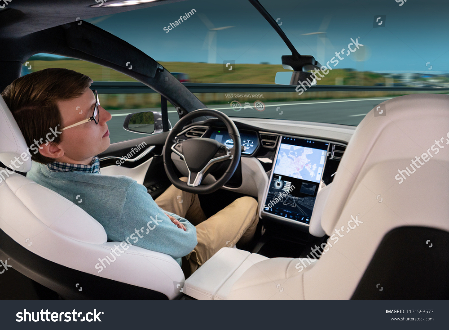 A man sleeps while his car is driven by an autopilot. Self driving vehicle concept #1171593577