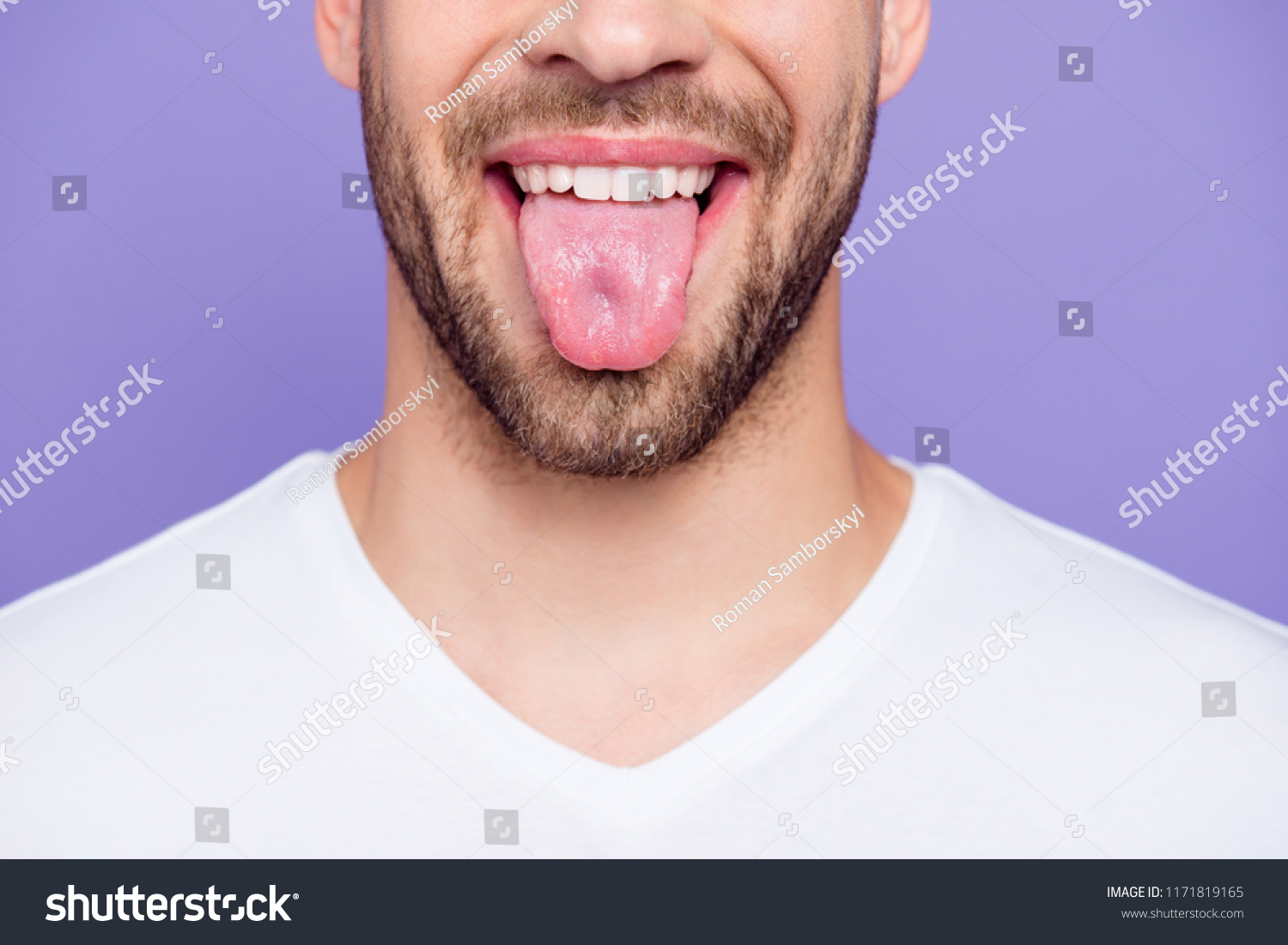 Close-up cropped portrait of attractive, trendy, stylish, toothy man with healthy teeth, showing tongue out, over pastel violet purple background #1171819165