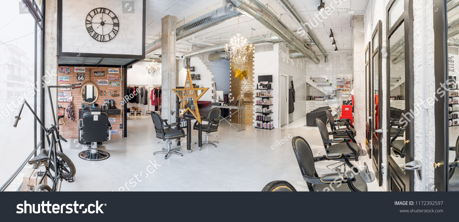 Panoramic view of a modern bright beauty salon. Hair salon and make up store, barber shop and manicure interior business  #1172392597