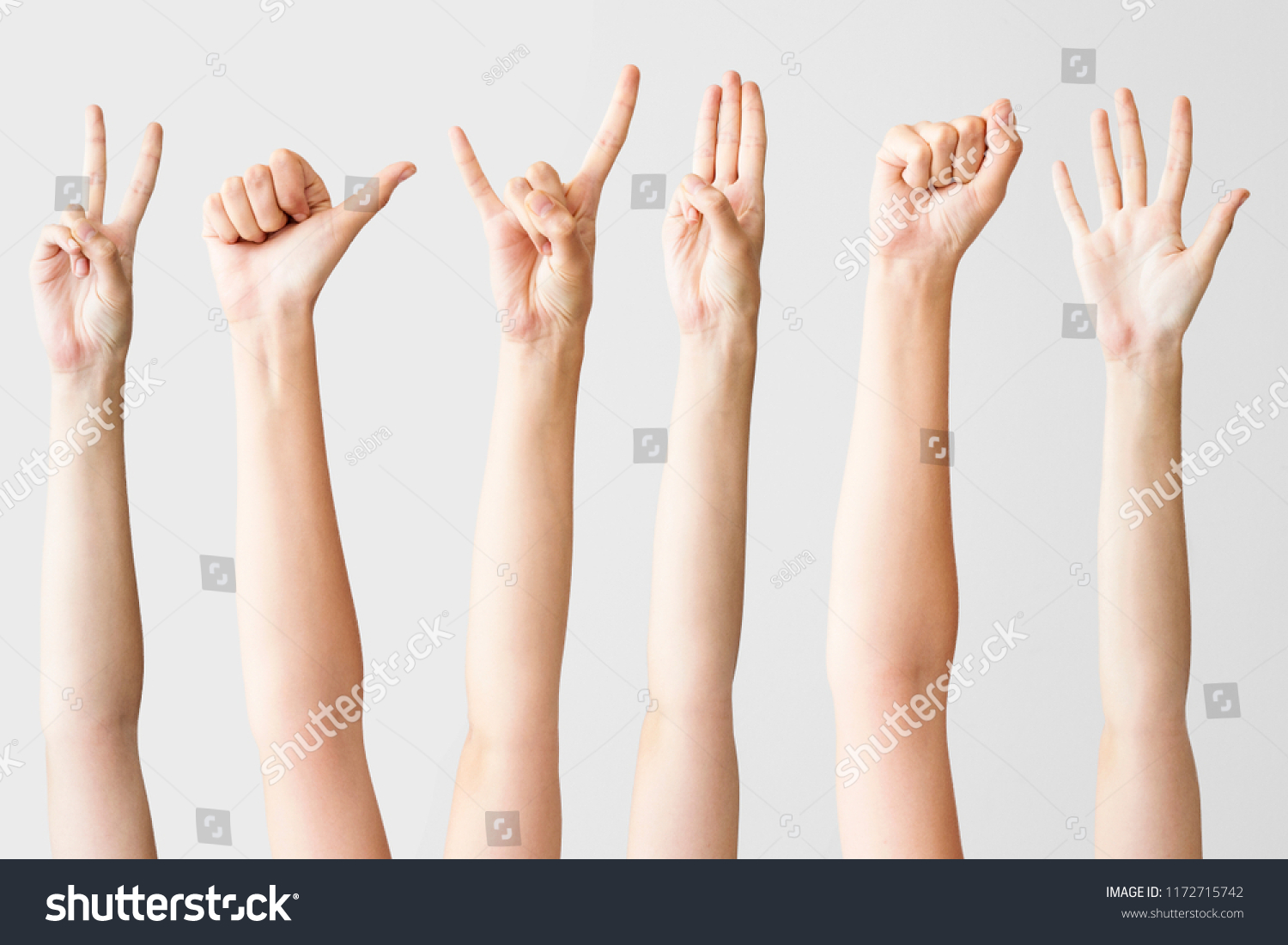 Multiple female hand gestures on gray background #1172715742