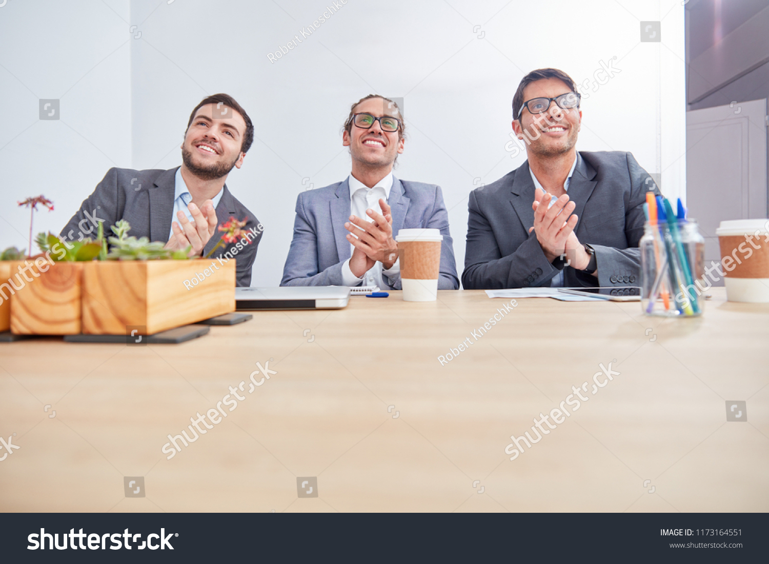 Three business men applaud in a seminar or seminar #1173164551