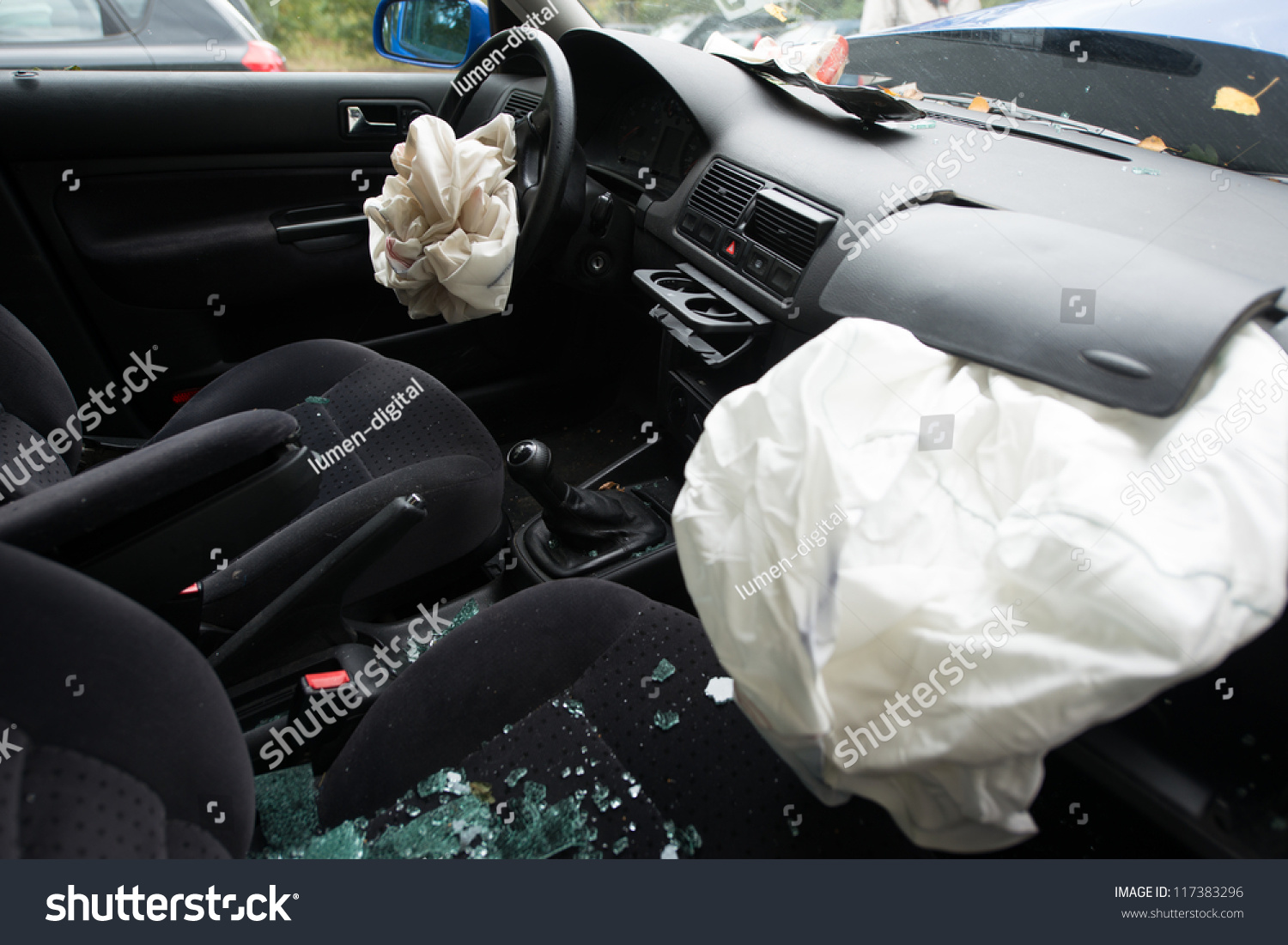 damaged car with deployed airbags #117383296
