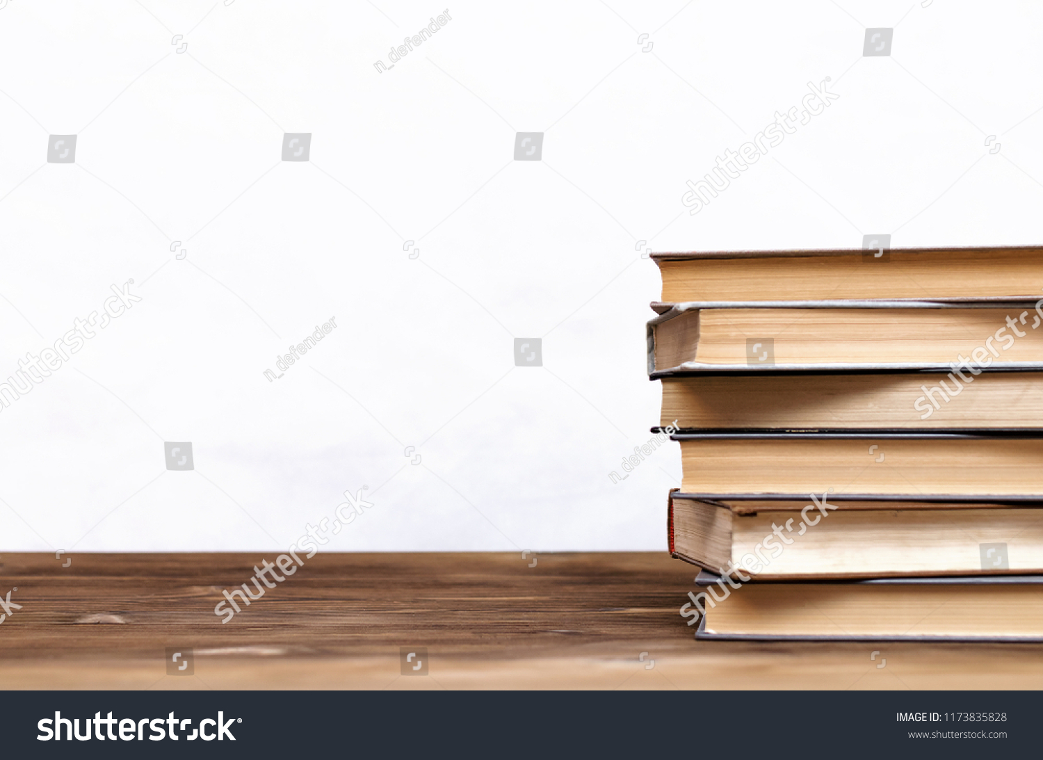 Stack of books on the school desk isolated on white background. #1173835828