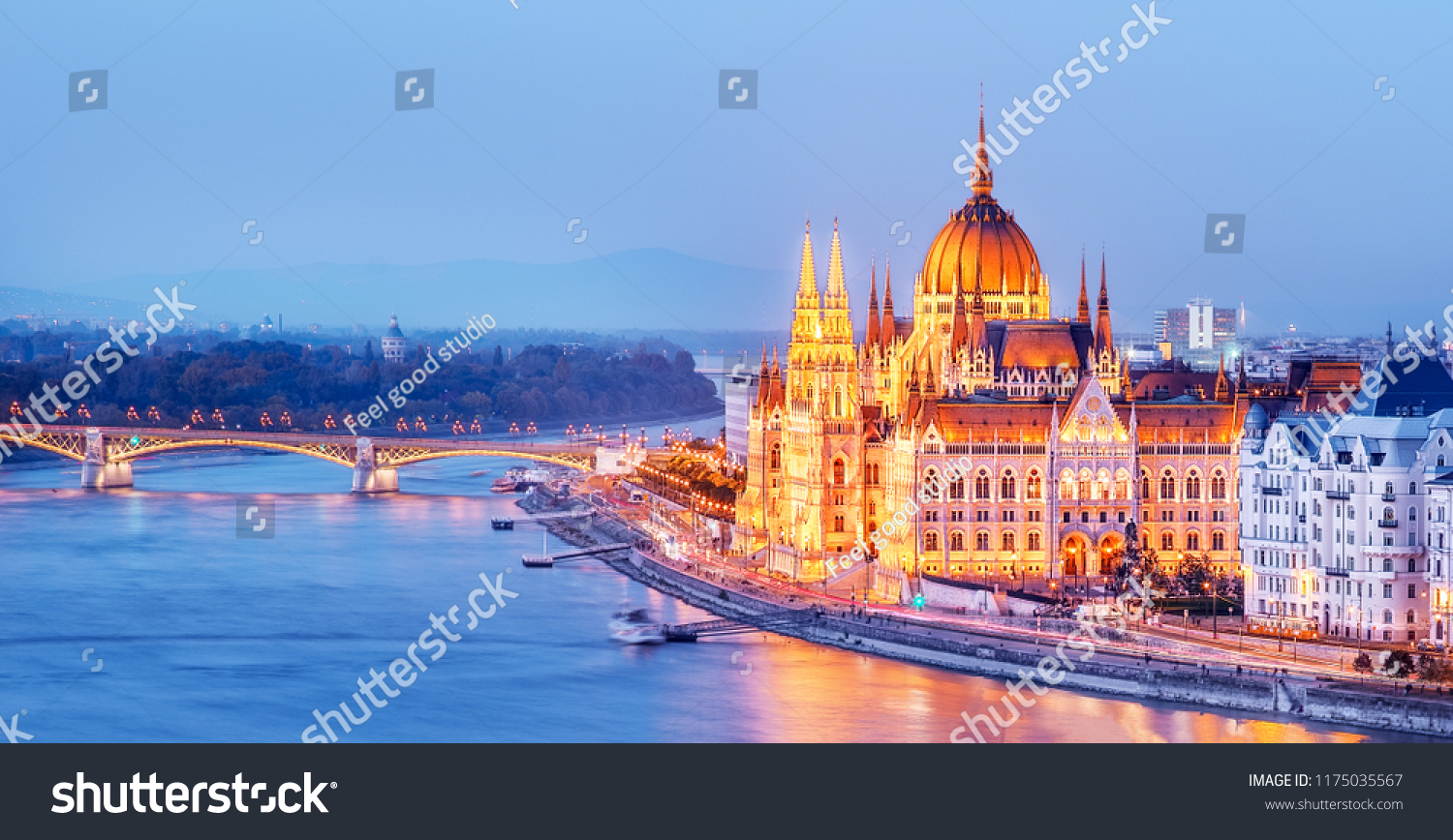 Budapest skyline, Hungary - illuminated Hungarian Parliament in twilight. Spectacular Panoramic view on Danube river delta and bridge. Famous European travel destination.  #1175035567