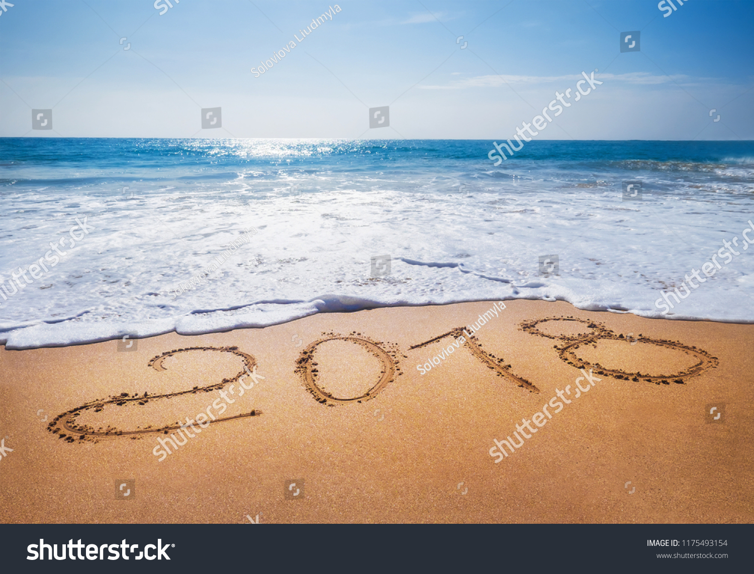 Old Year 2018 expires concept sandy tropical 
 ocean beach lettering concept image and Happy New Year 2019 is coming #1175493154