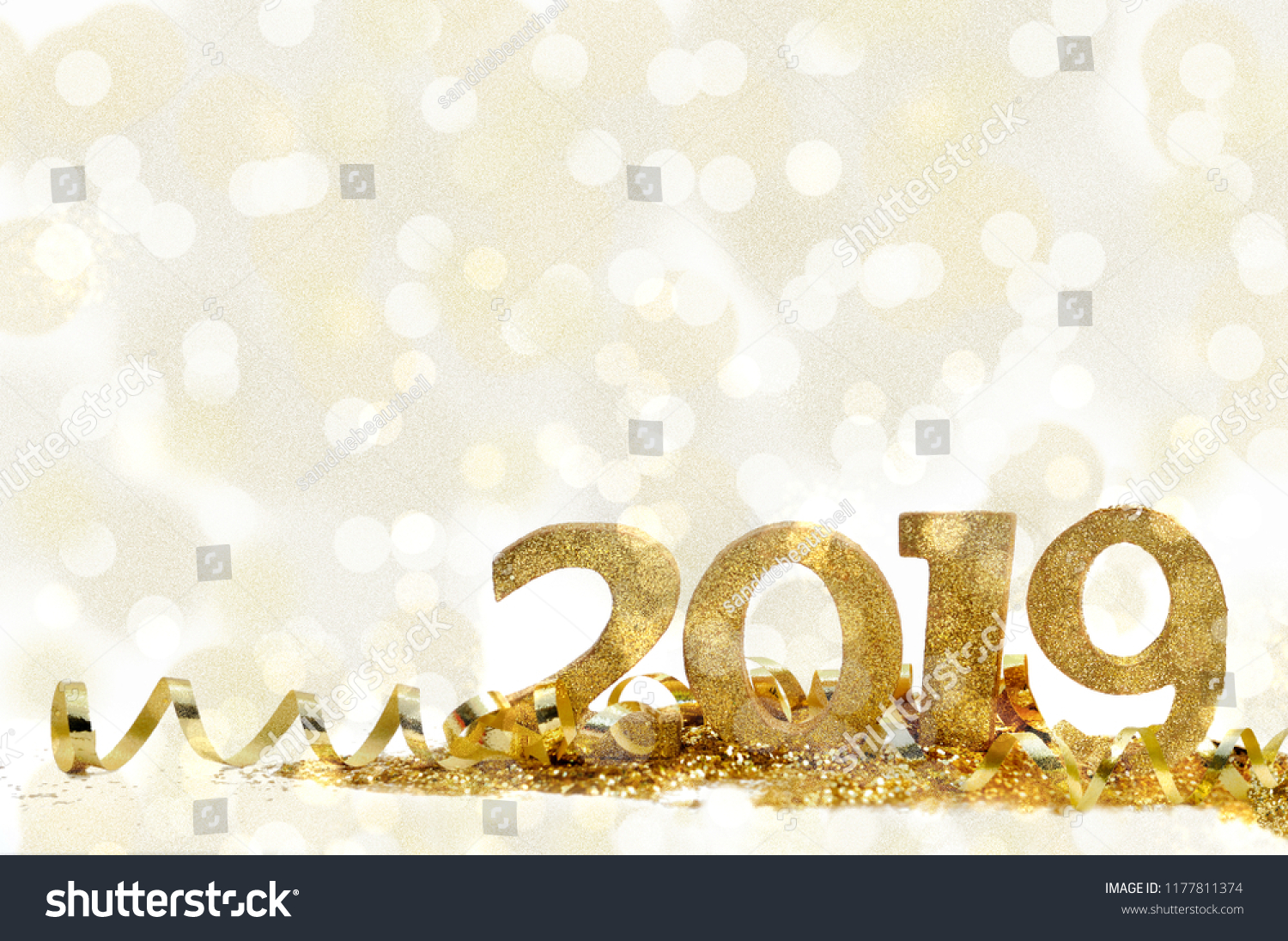golden figures 2019 on glitter and bright bokeh background #1177811374