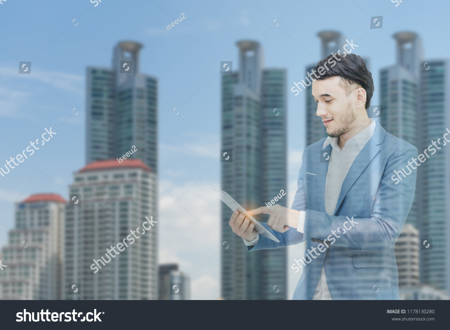Mix image.Business man holding smartphone in hand with background city view. #1178130280