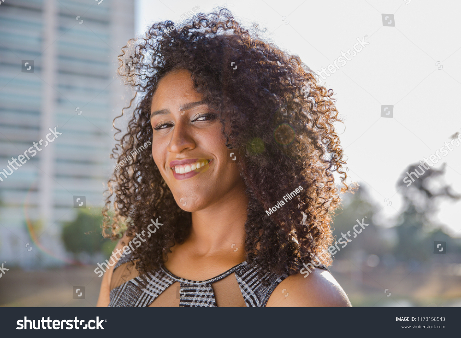 Portrait of smiling young black woman #1178158543