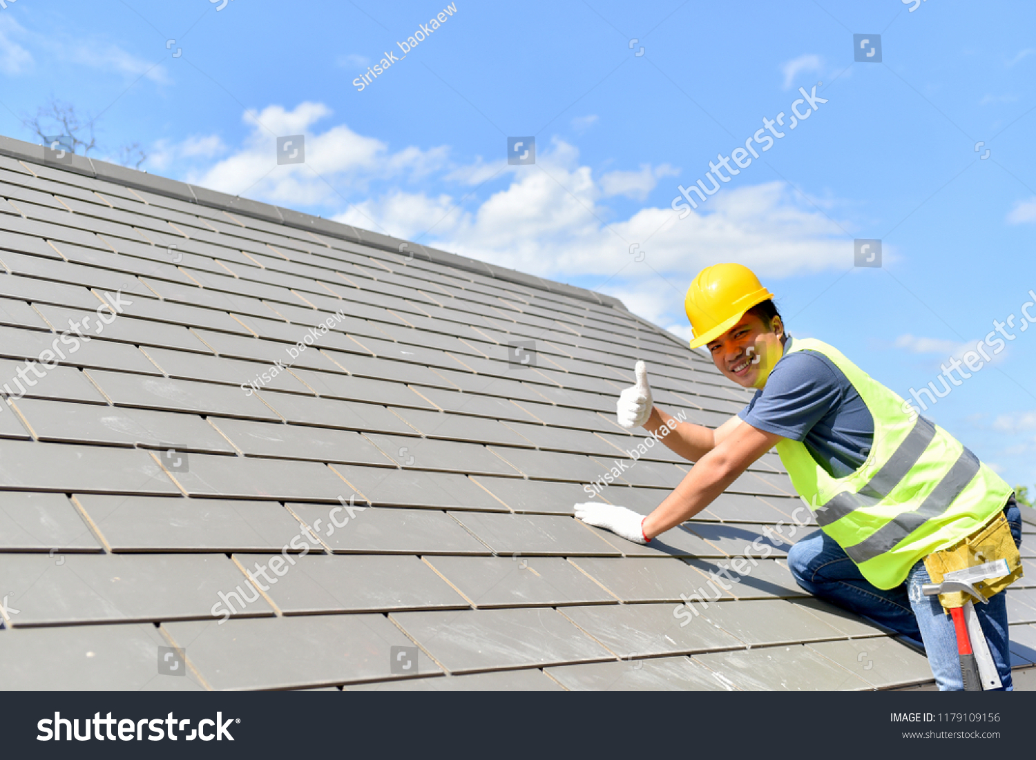 Builder Working On Roof Of New Building #1179109156