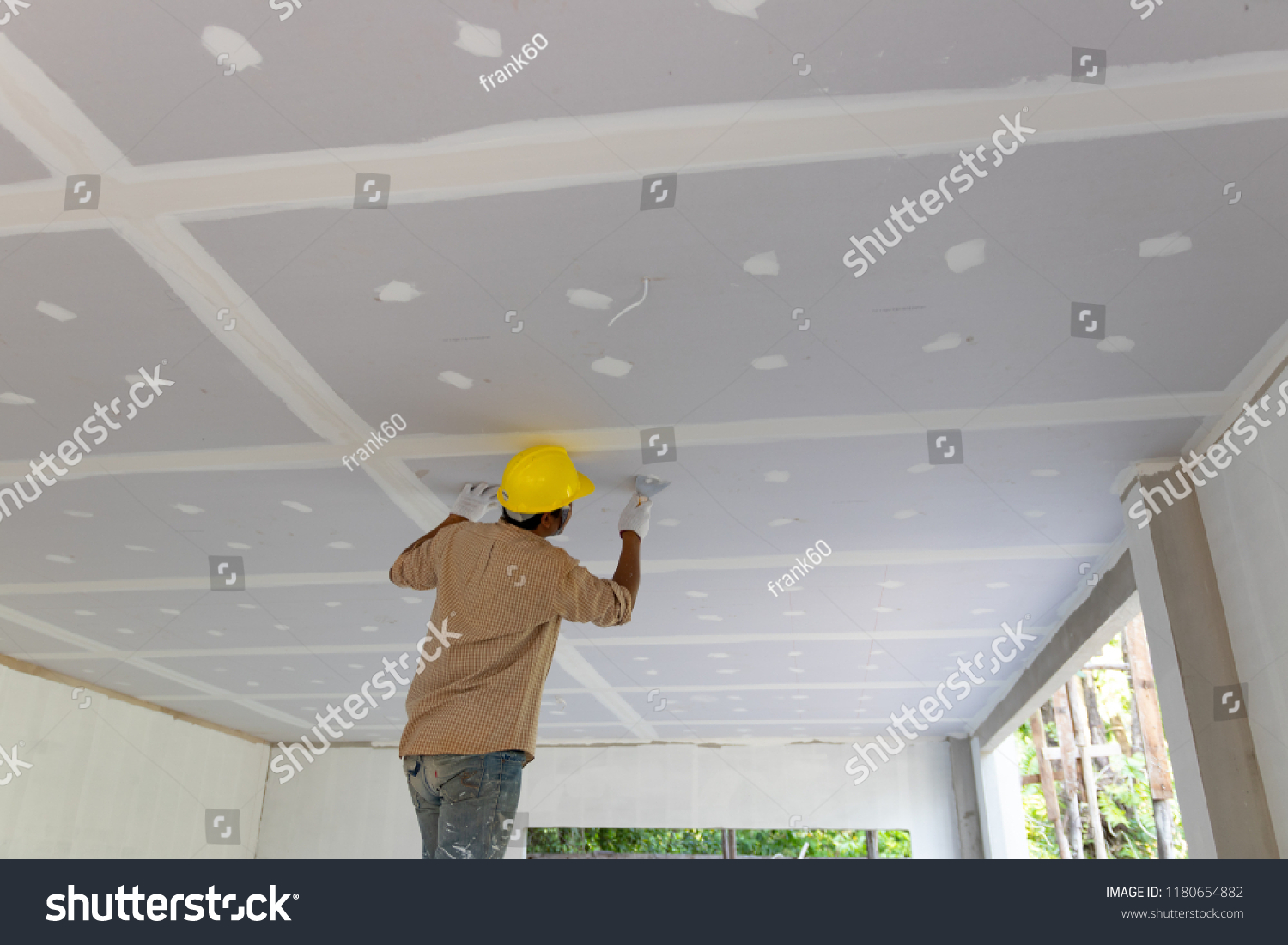 Construction man worker plaster gypsum ceiling for interior build gypsum board ceiling #1180654882