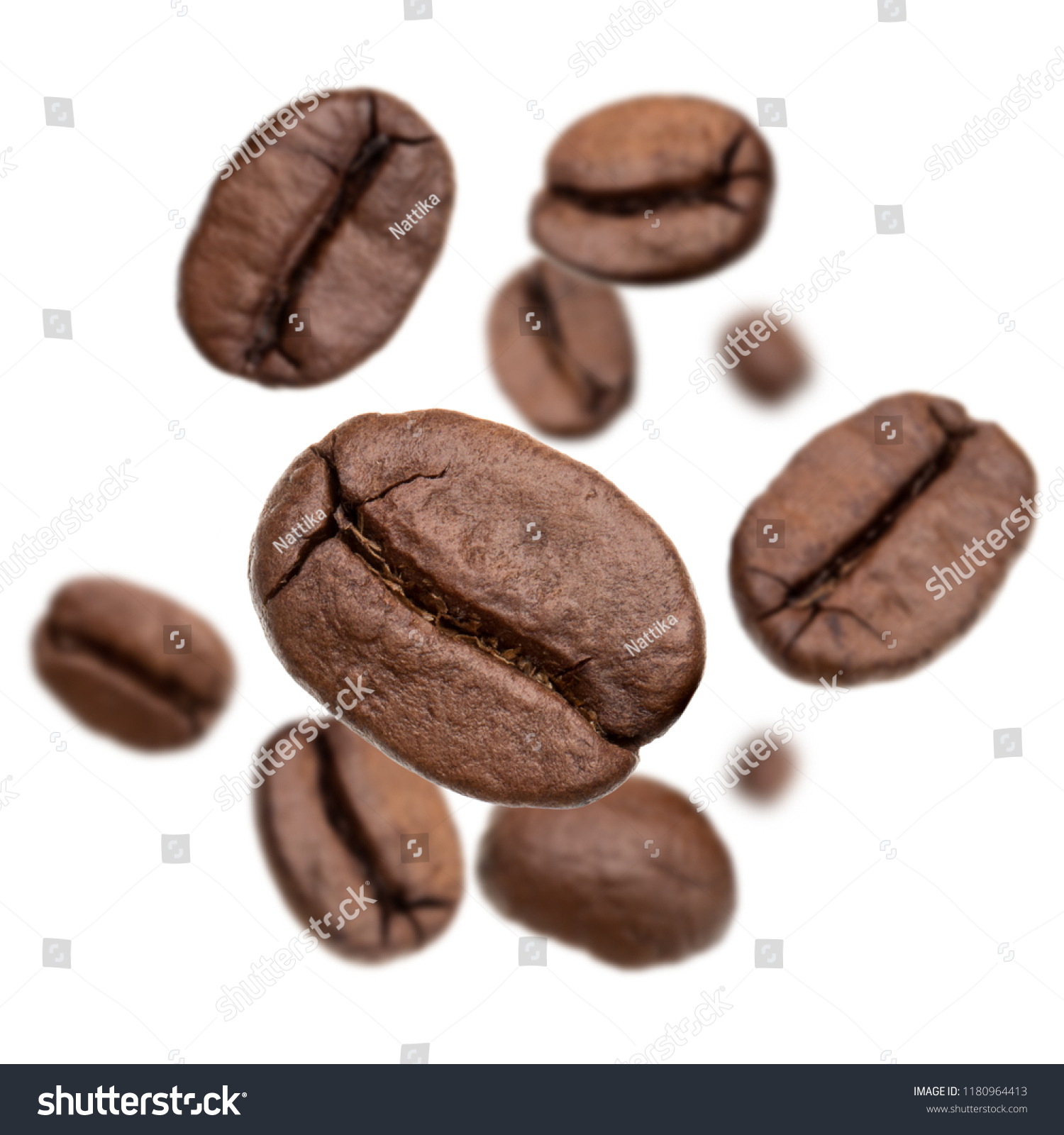 Flying roasted coffee beans isolated in white background cutout. Food background. #1180964413