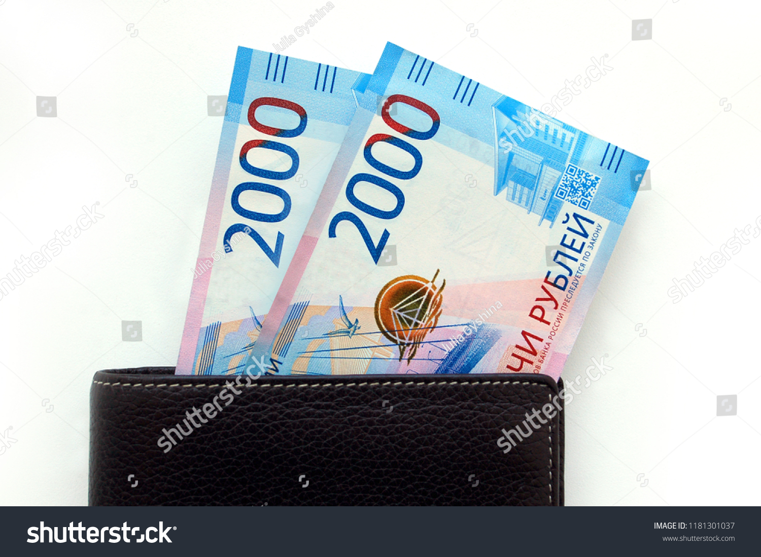 Russian cash. Bill in 2000 rubles. Black man's purse. Isolated on white #1181301037