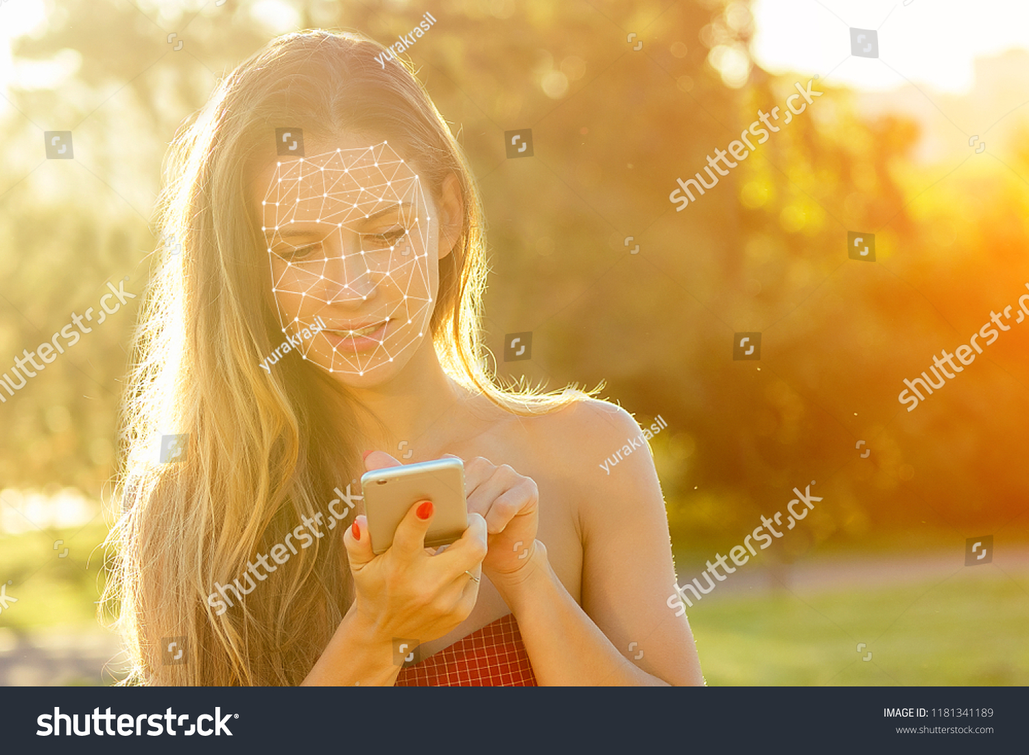 model woman long-haired in red dress holds phone and talking typing text with boyfriends in hand rays of sun background . enamored girl chating with friends in the park, concept face id #1181341189