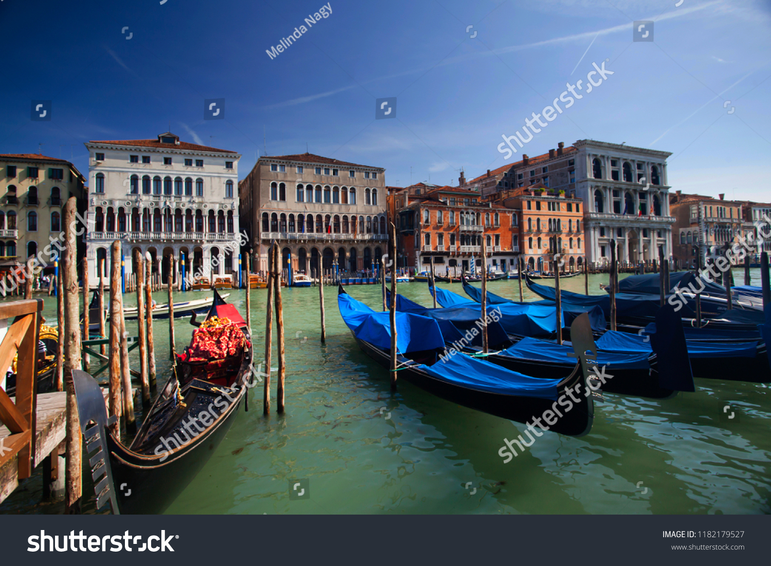 Gondolas pier row anchored on Canal Grande, Venice, Italy #1182179527