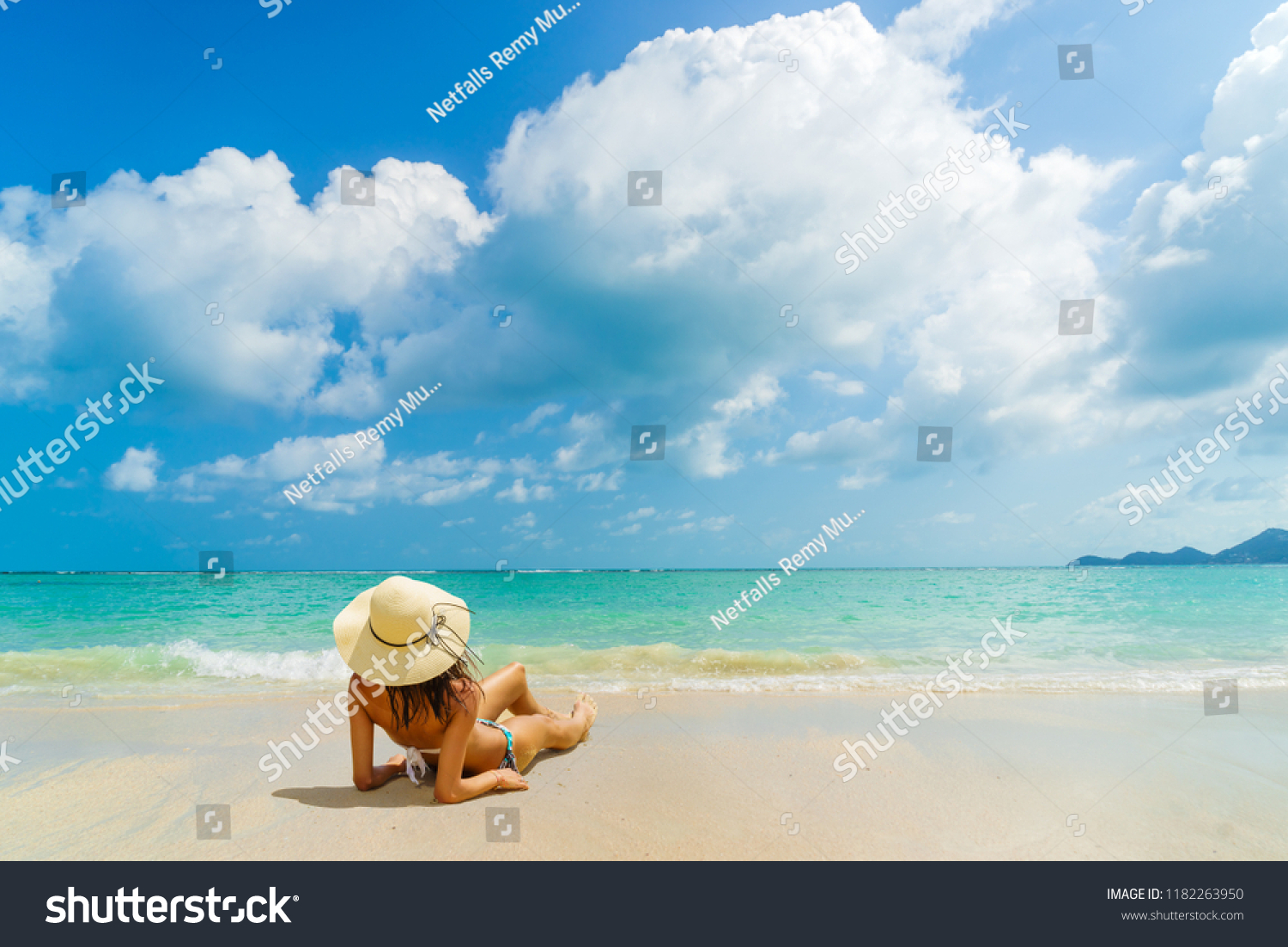 Woman suntanning - Winter holidays at the tropical beach #1182263950