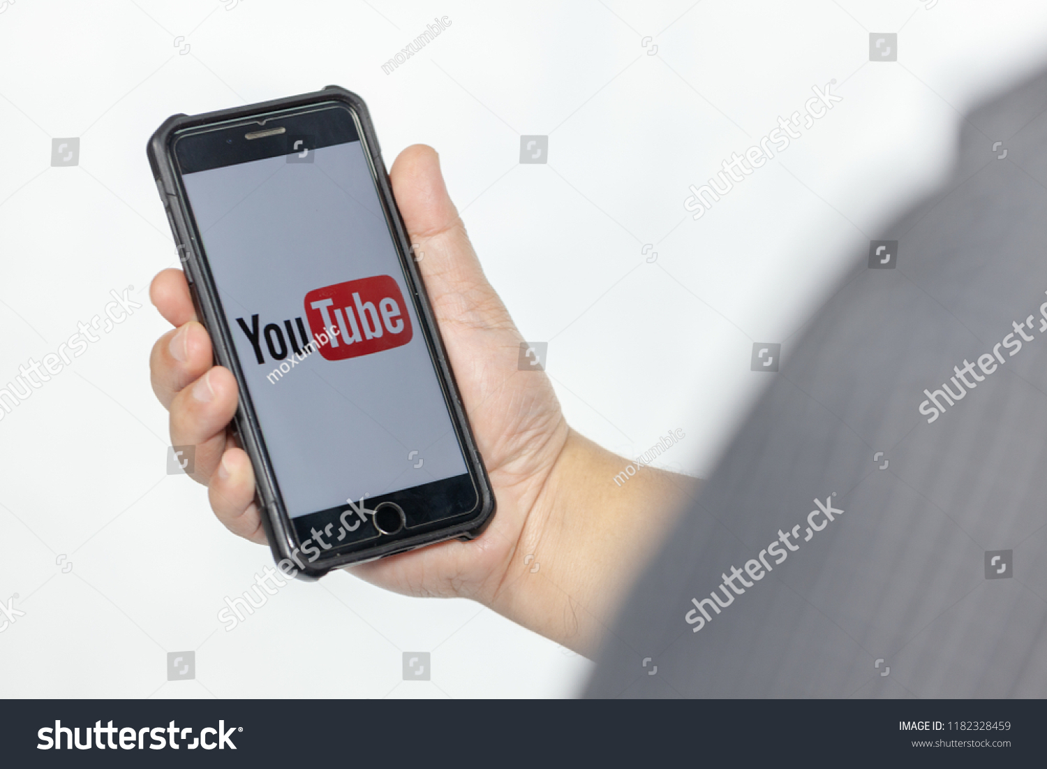 PATHUMTHANI, THAILAND - SEPTEMBER 18, 2018: hand holding iphone7 plus mobile phone with youtube icon application #1182328459
