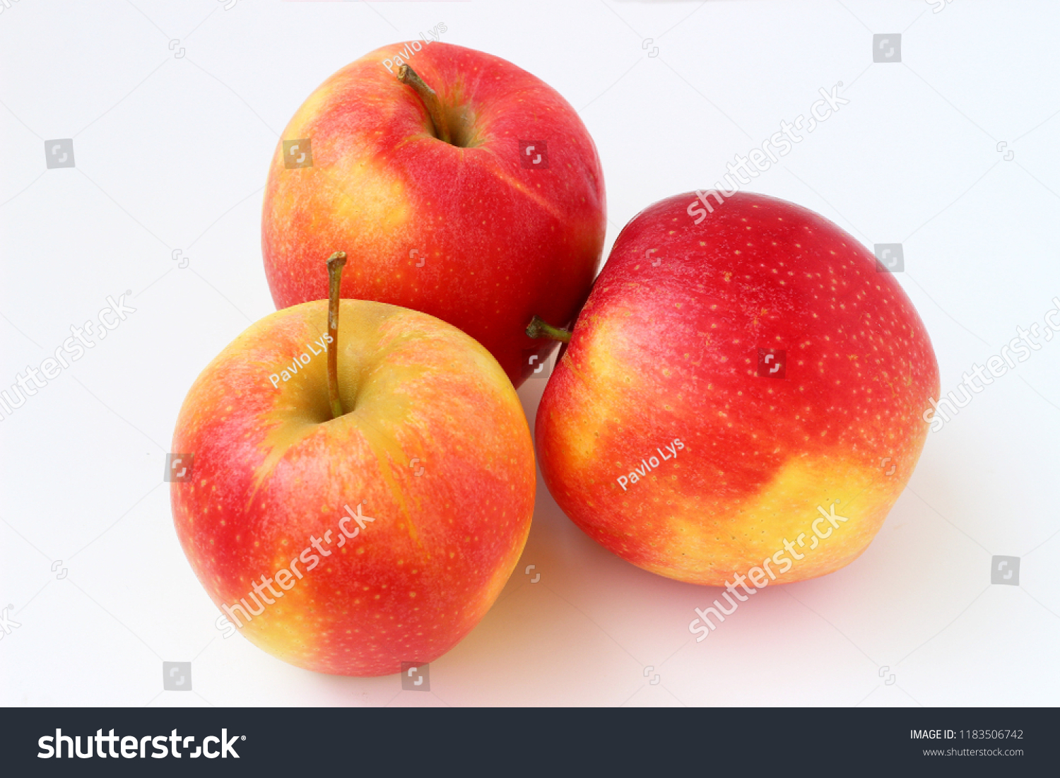 Three red apples on a white background #1183506742