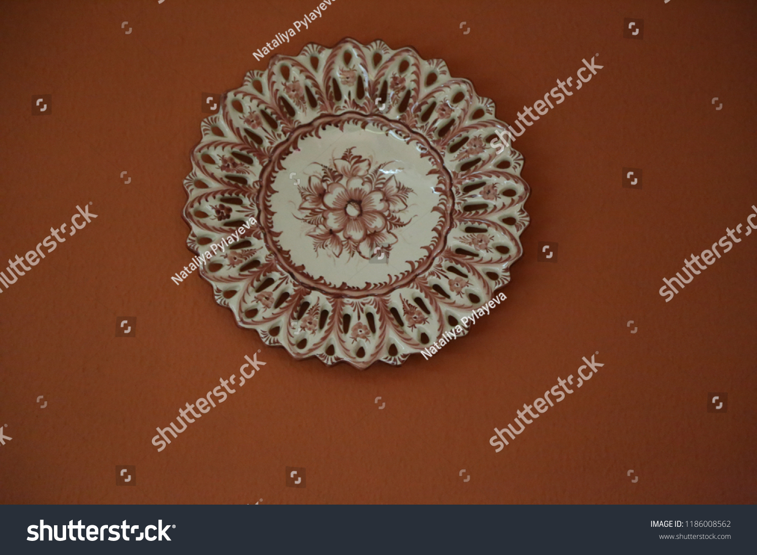 Restaurante Central do Bom Jesus,brown white ceramic traditional national plate with text and flower pattern hanging on the wall #1186008562
