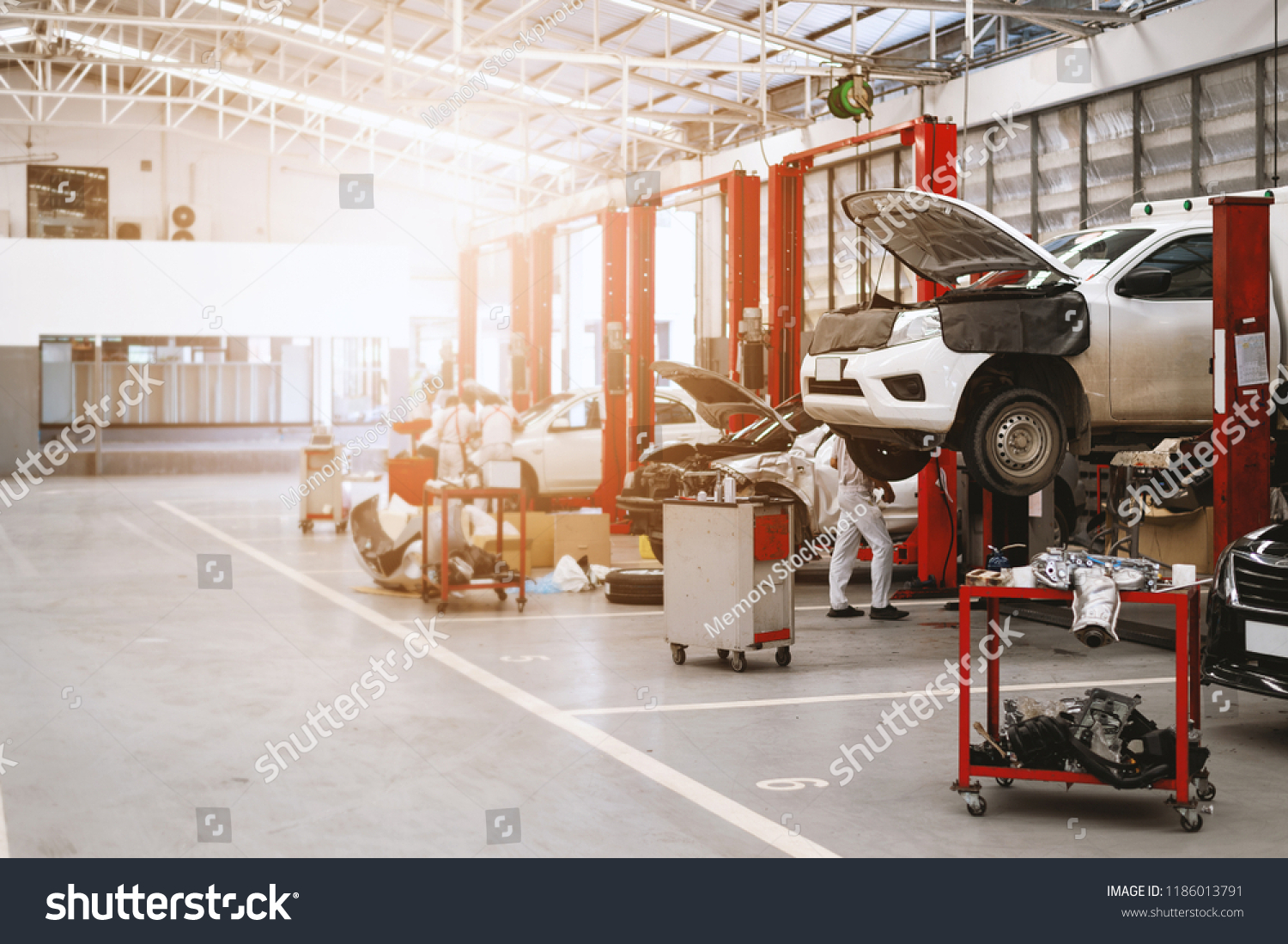 car repair station with soft-focus and over light in the background #1186013791