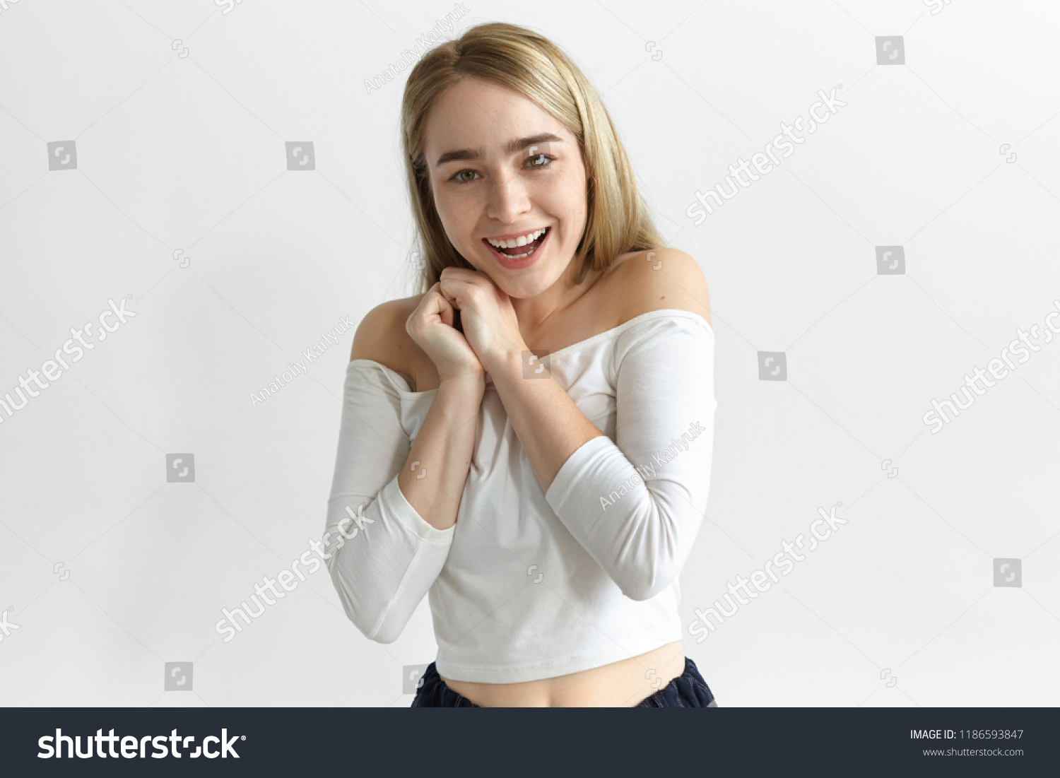 Positive human reaction, feelings, attitude and emotions. Picture of adorable excited young fashionable woman expressing joy and amazement, fascinated with good news, being finally promoted at work #1186593847