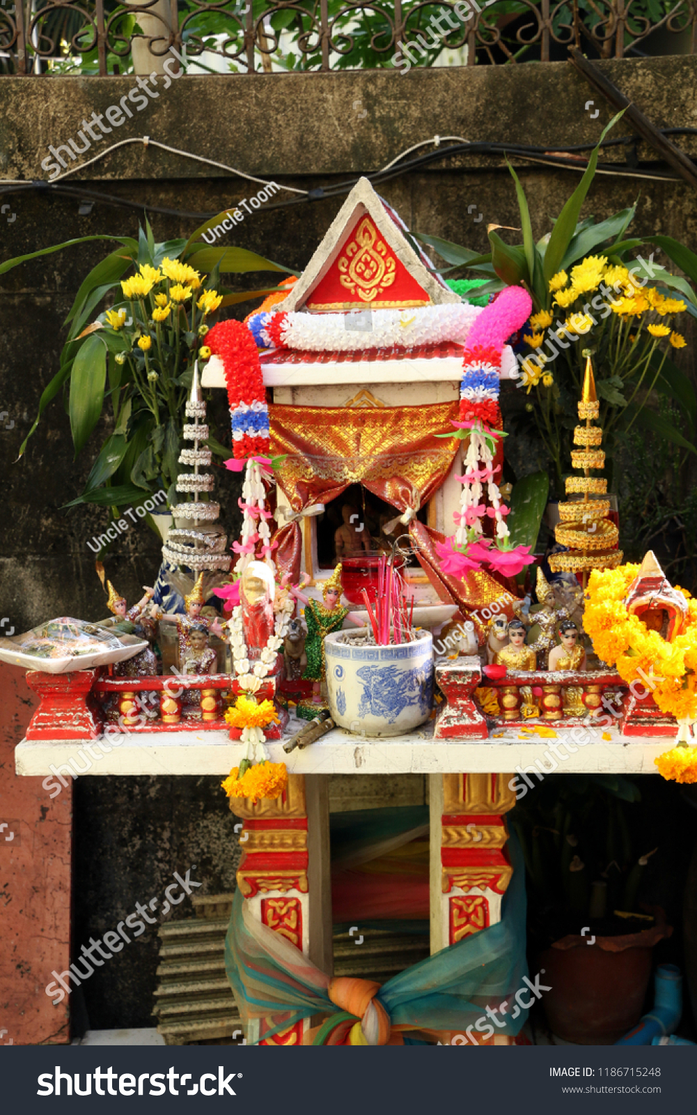 Spirit House - Spirit houses in front of family's resident. This shows that all Thai people may have spirit house as a guardian and bring good luck to the family. #1186715248