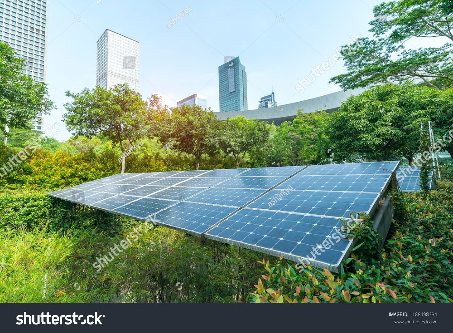 Ecological energy renewable solar panel plant with urban landscape landmarks #1188498334