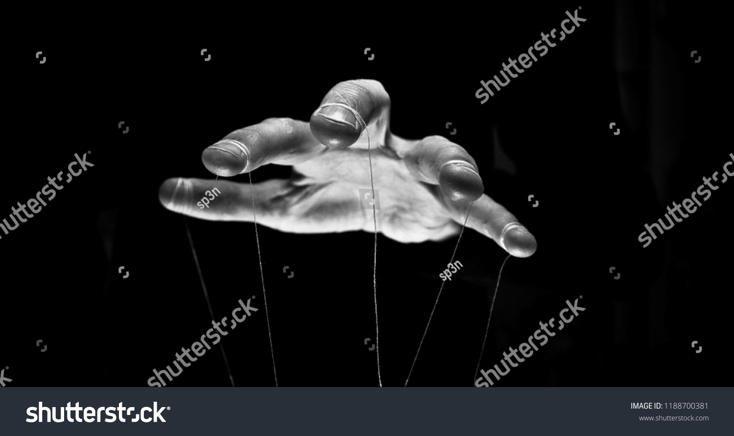 Eerie puppeteer hands controlling you. Manipulation concept #1188700381