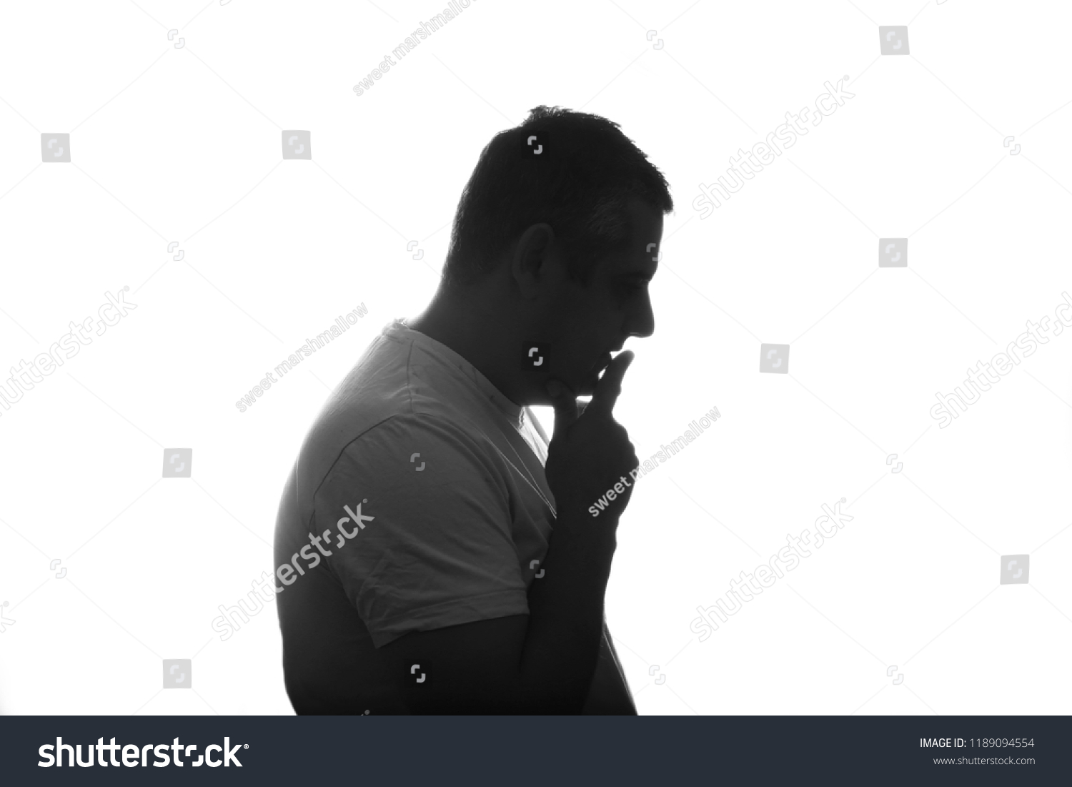 Silhouette of man posing on white background. Close up. place for text. #1189094554