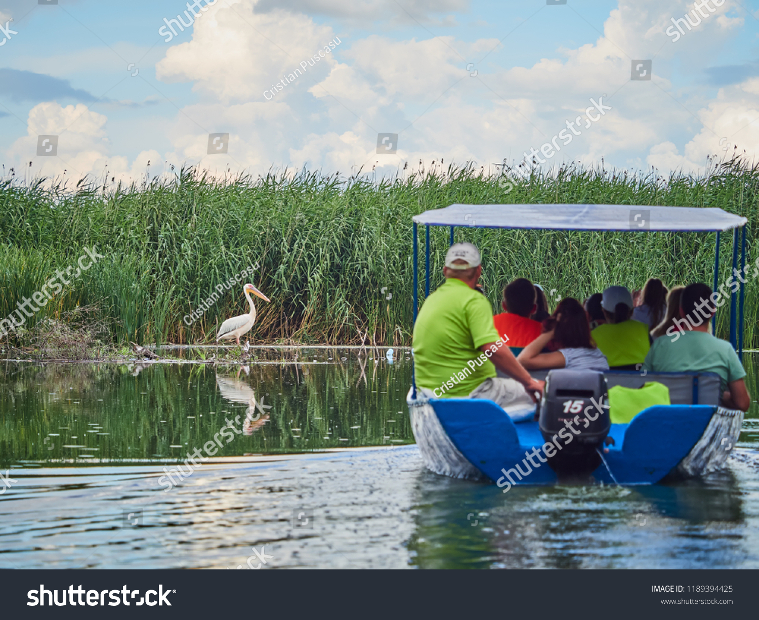 Tourists on a boat in the Danube Delta, Romania
 #1189394425