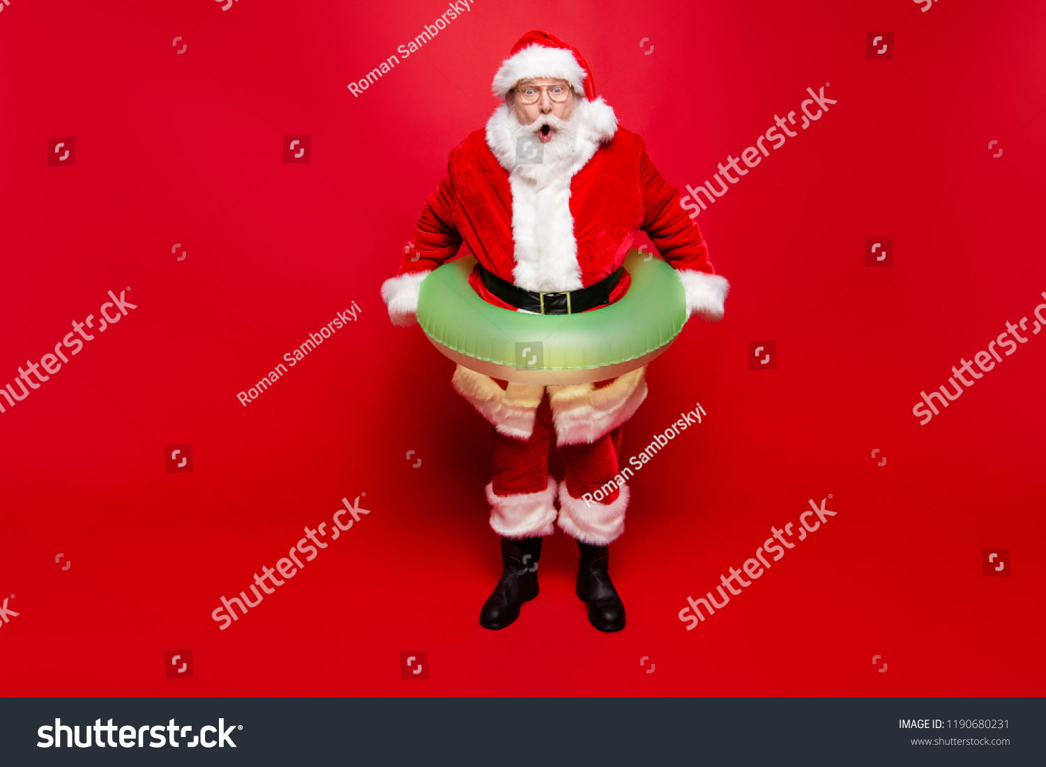 December noel eve sale discount pool party. Full legs body size aged mature grandfather funny Santa tradition costume headwear spectacles white beard isolated red background open mouth staring eyes #1190680231