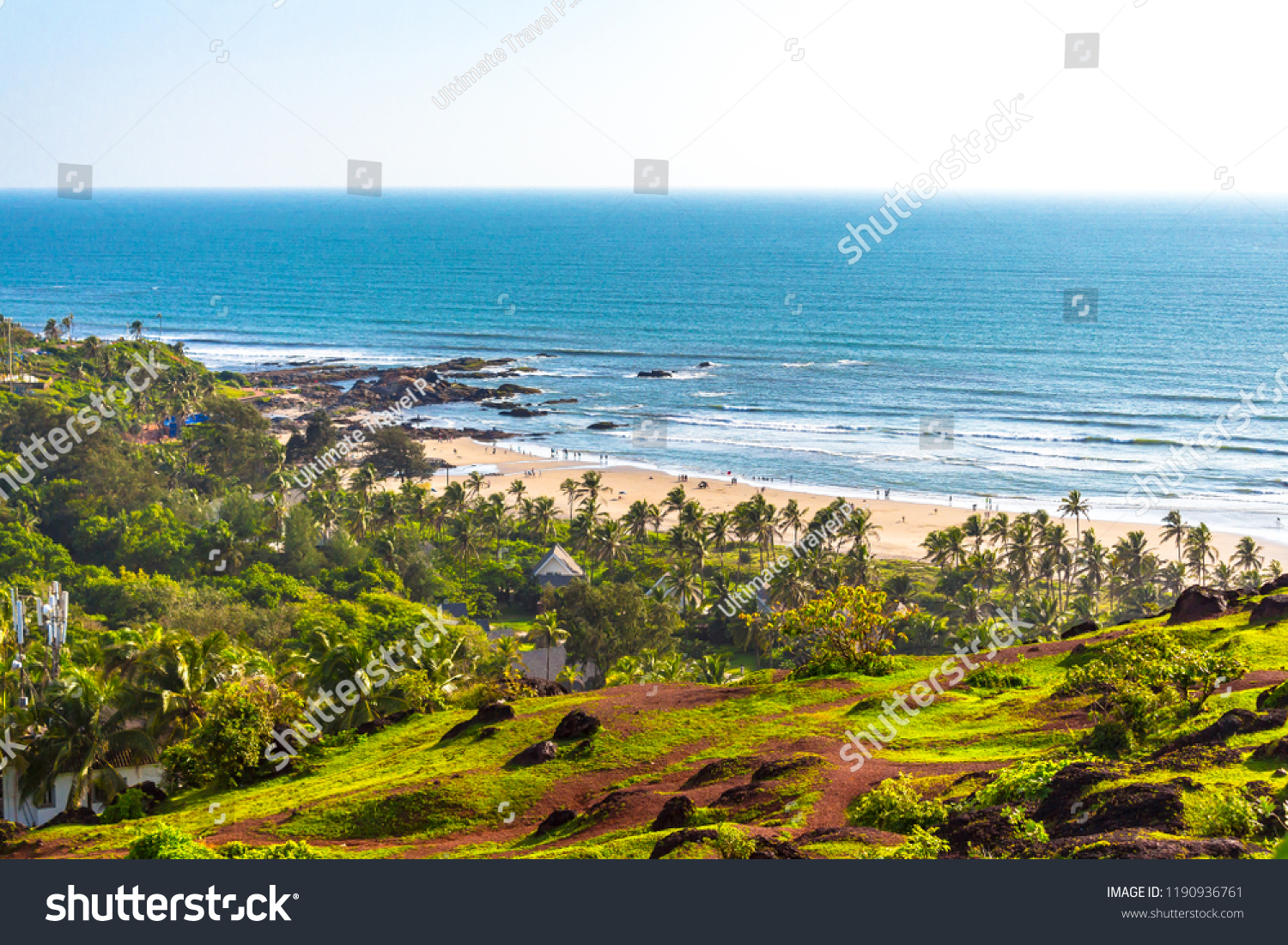Evergreen natural beauty of Vagator beach from Chapora Fort located in Goa, India. Vagator Beach & Chapora Beach are two beautiful beaches in North Goa. Tropical beach in Goa with palm trees & ocean. #1190936761