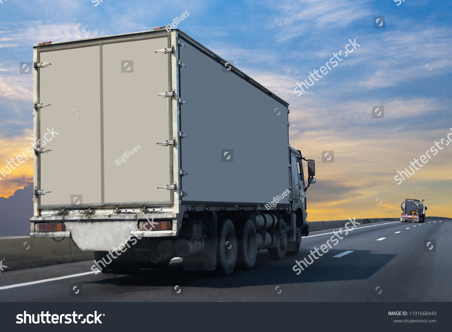 White Truck on highway road with  container, transportation concept.,import,export logistic industrial Transporting Land transport on the asphalt expressway  #1191668449