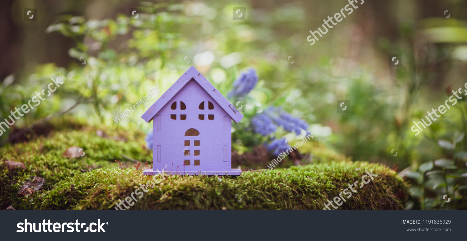 fabulous, toy house, the colors of lavender, against the backdrop of a fairy forest. Concept cozy home, cozy world. #1191836929